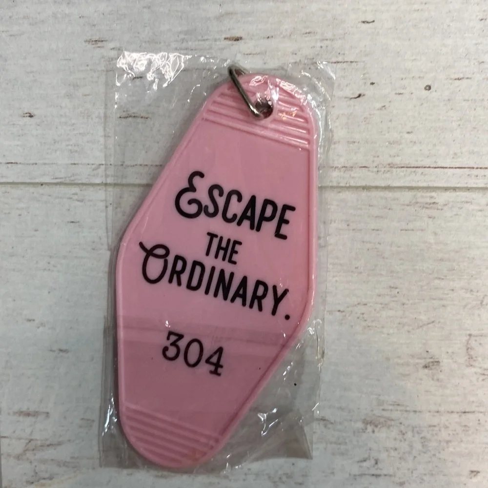 Medusa’s Makeup Light Pink “Escape the Ordinary” Hotel Room Key Chain